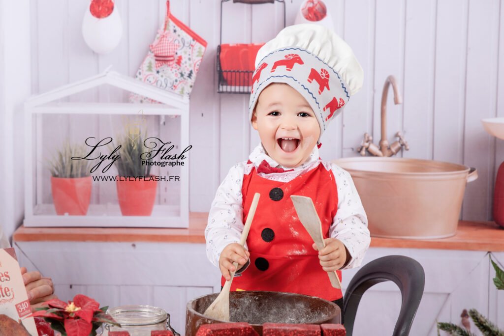 Une petite fille heureuse de cuisiner a noël en shooting a Pontet