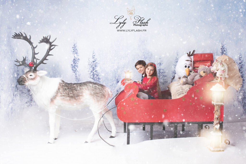 photo enfant dans le traineau du père Noël a Nice